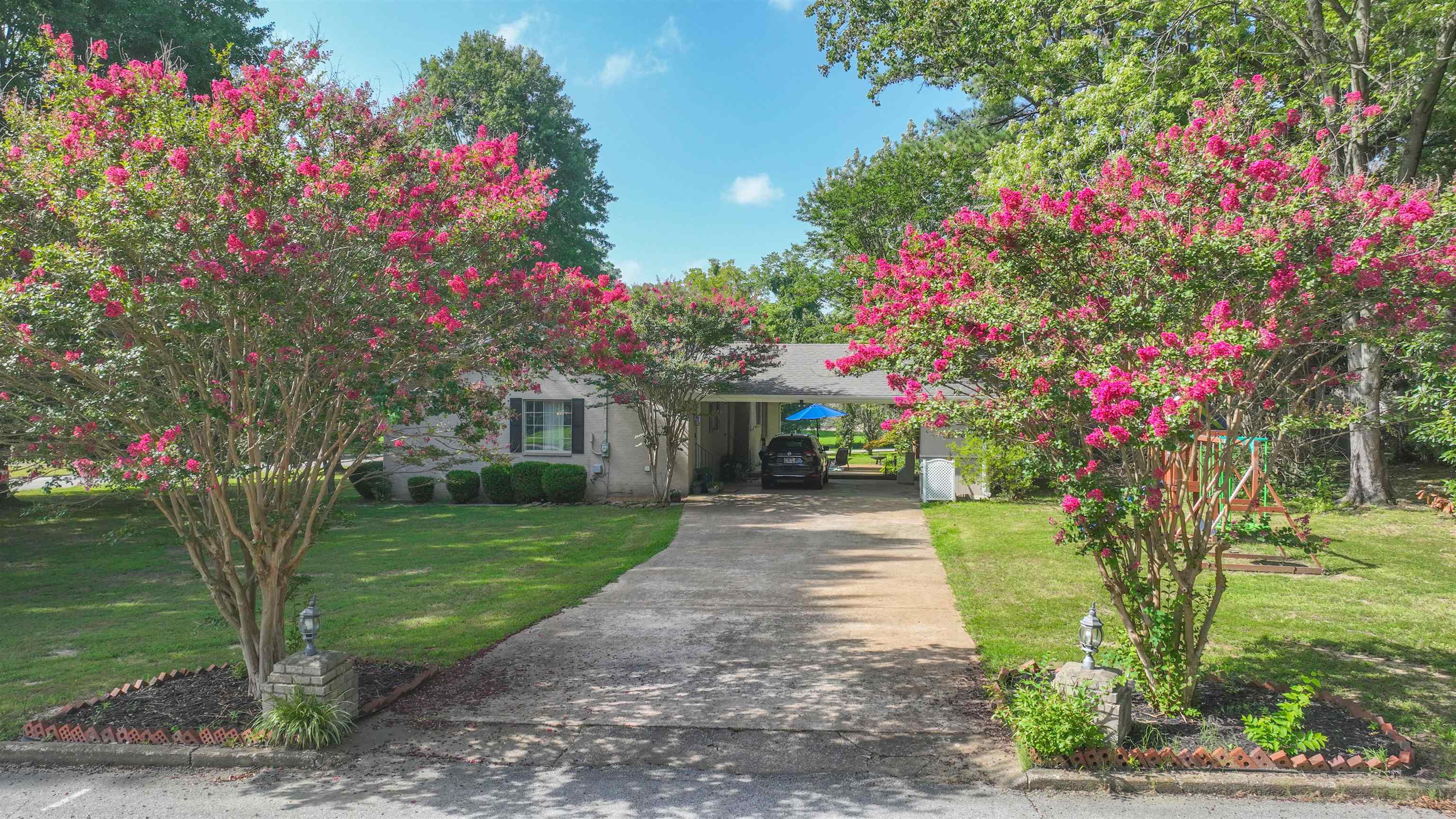 129 Thompson Drive Ripley, TN 38063 - Photo 3 of 22 a front view of a house with a yard and tree s