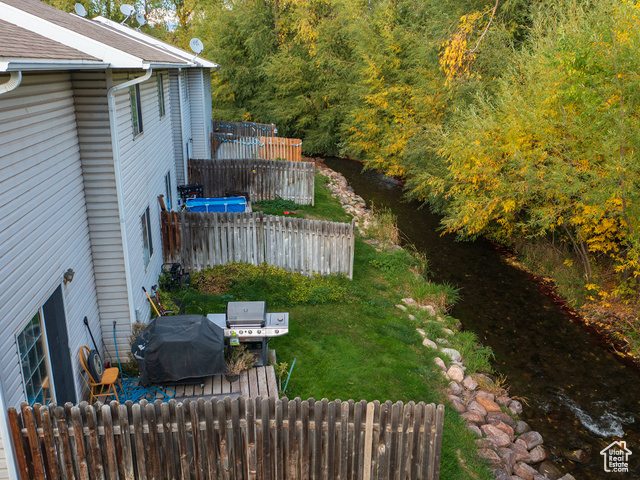 190 West 700 North Logan, UT 84321 - Photo 23 of 51 Fenced yard featuring radiator and a water view