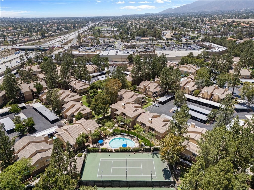10655 Lemon Avenue, Unit 104 Rancho Cucamonga, CA 91737 - Photo 19 of 21 Tennis court and one of three pools