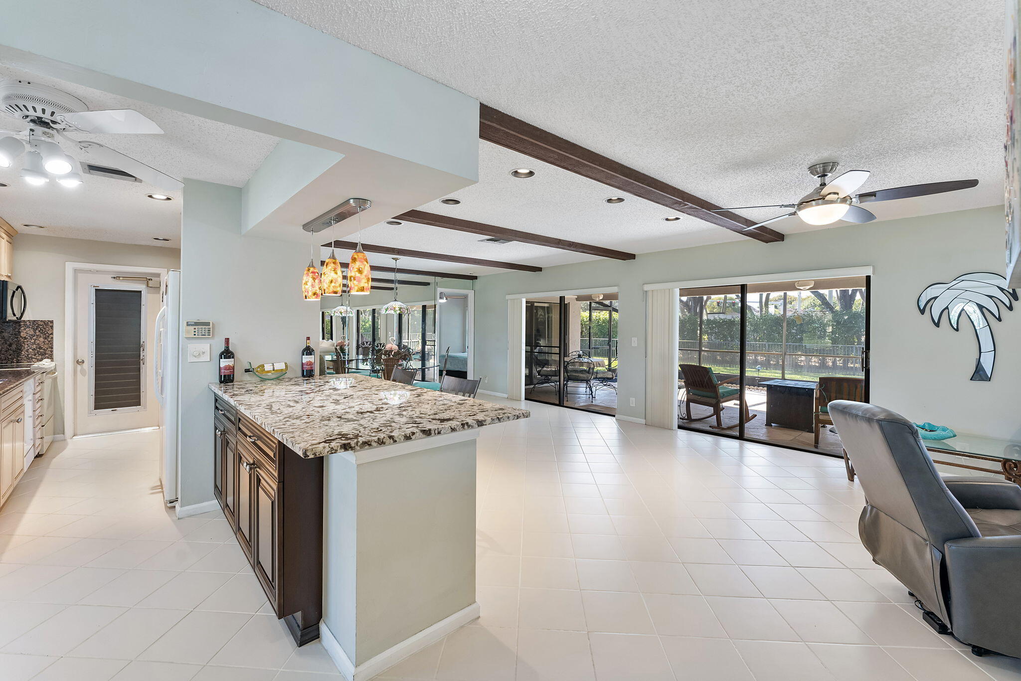 6206 Springdale Way Delray Beach, FL 33484 - Photo 24 of 38 a kitchen with granite countertop a sink and a stove