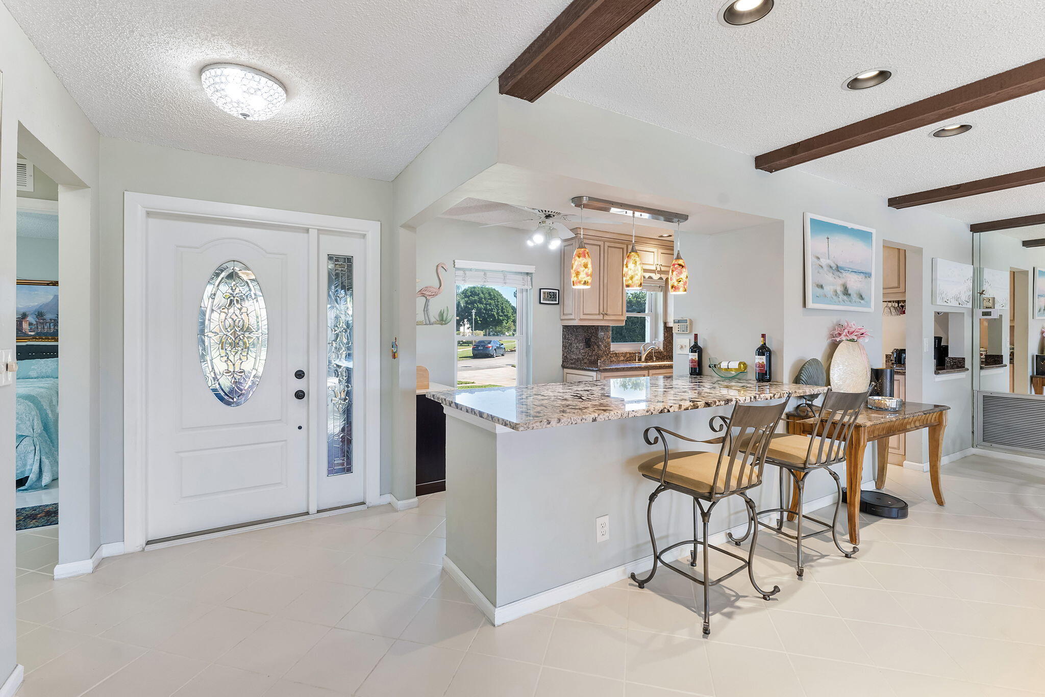 6206 Springdale Way Delray Beach, FL 33484 - Photo 25 of 38 a view of a dining room with furniture