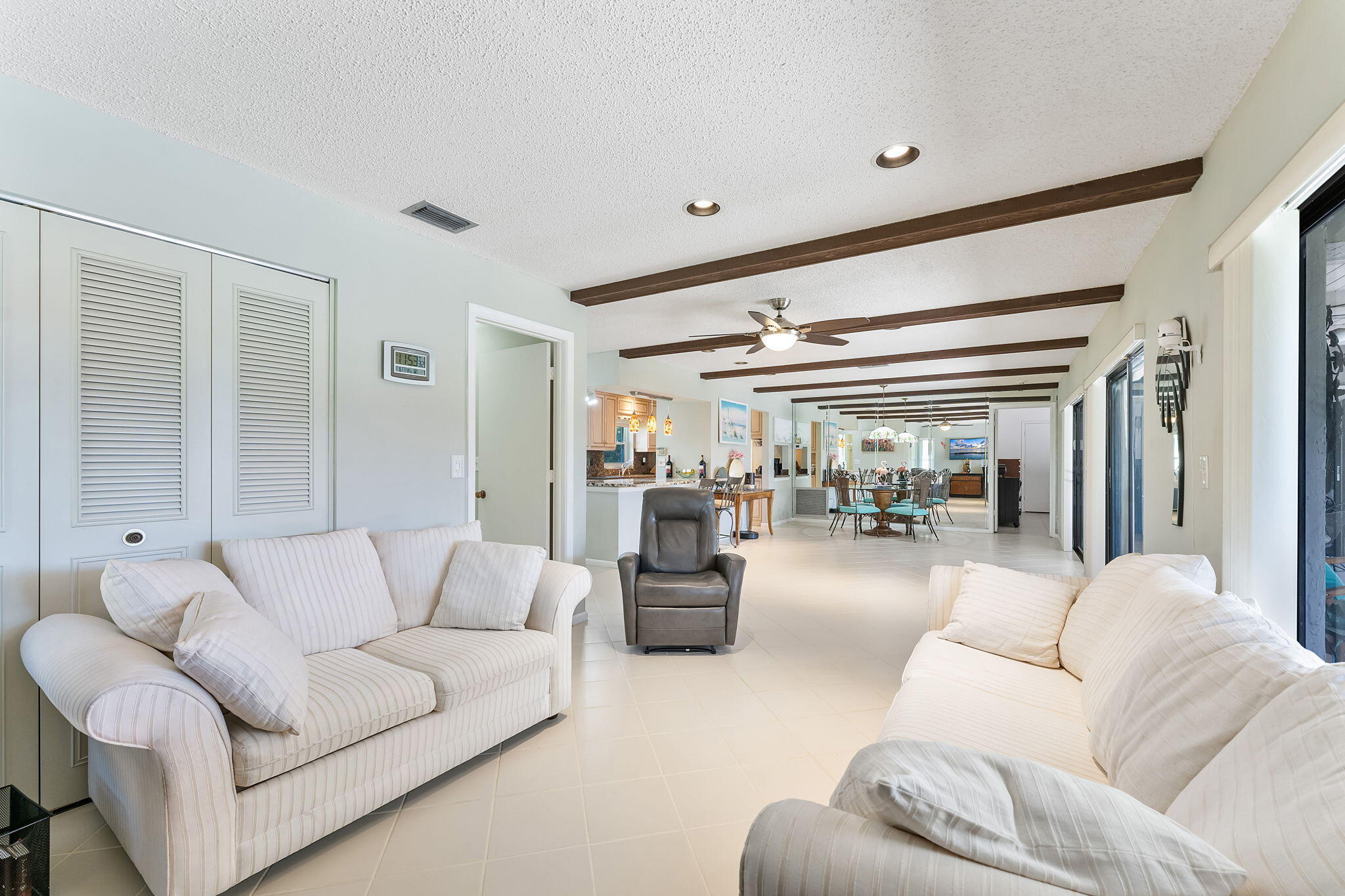 6206 Springdale Way Delray Beach, FL 33484 - Photo 30 of 38 a living room with furniture and a large window