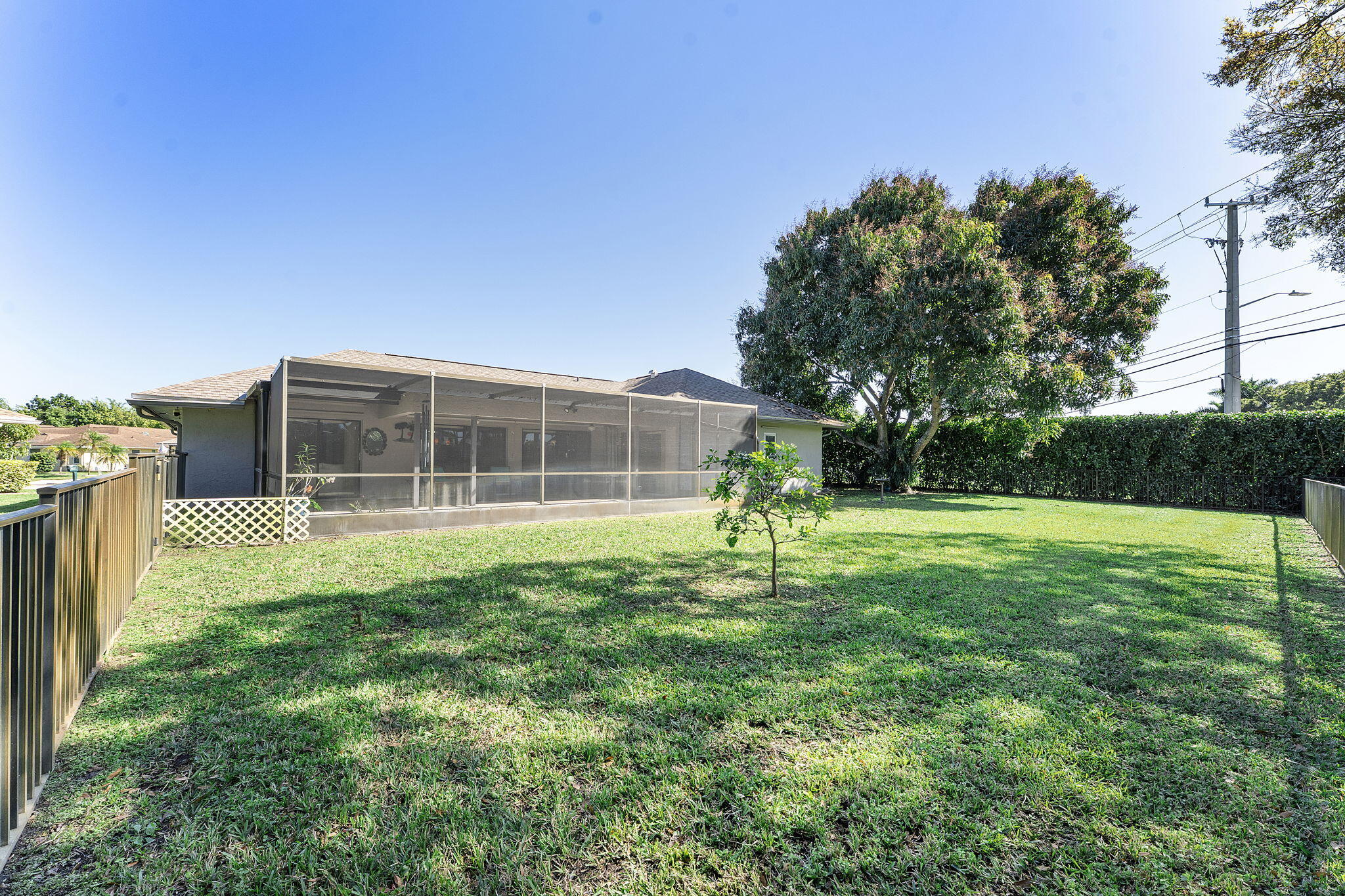 6206 Springdale Way Delray Beach, FL 33484 - Photo 7 of 38 a house view with a garden space