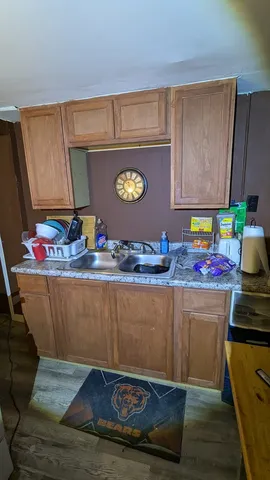 a living room with granite countertop furniture and a potted plant