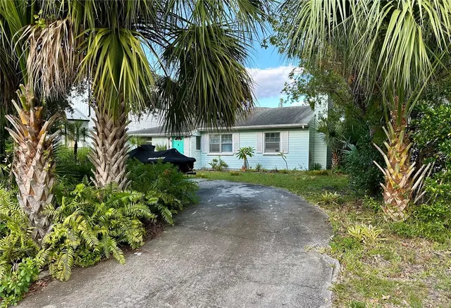 a front view of house with small garden