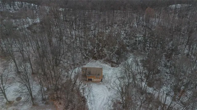 a aerial view of a house with a yard