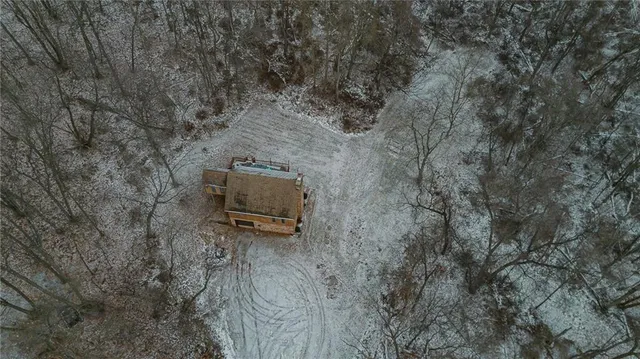 a view of a backyard with wooden fence