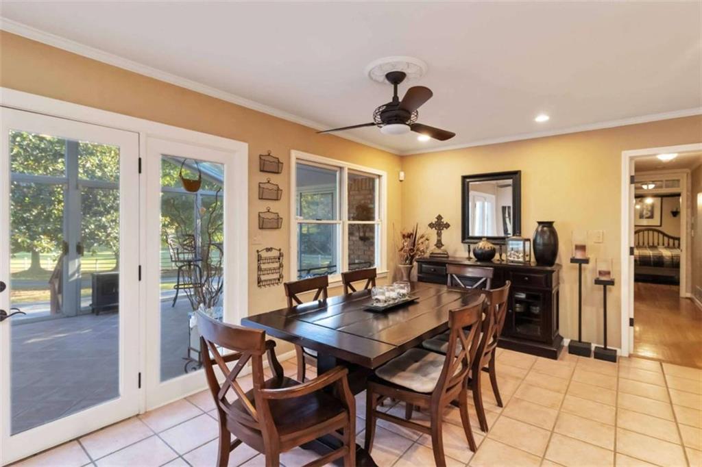5888 Old Stone Mountain Road Stone Mountain, GA 30087 - Photo 11 of 61 a view of a dining room with furniture window and outside view