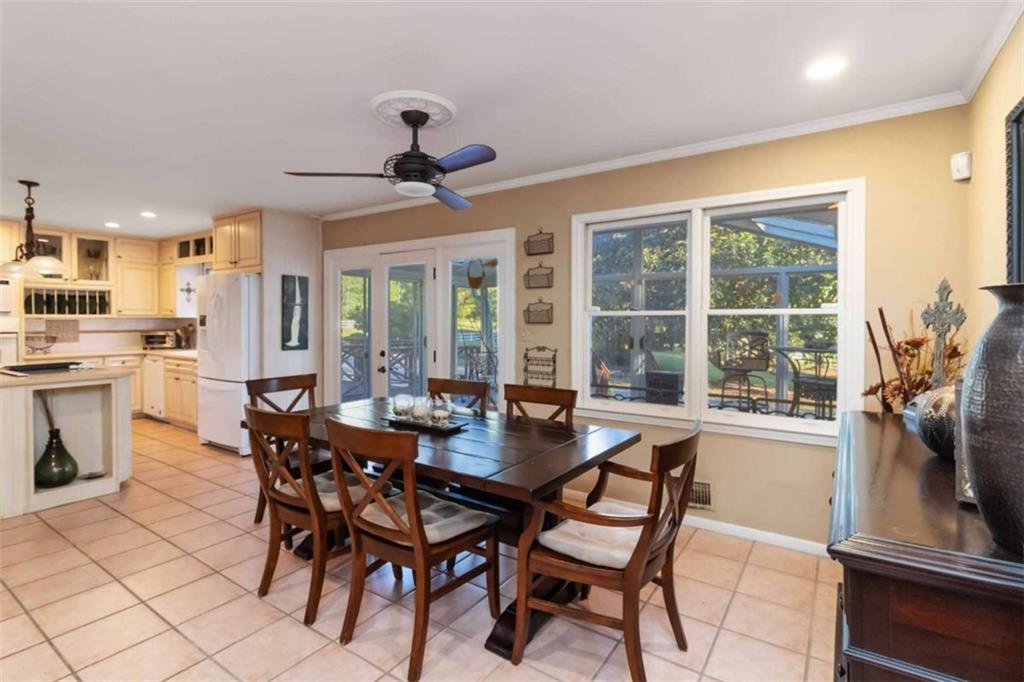 5888 Old Stone Mountain Road Stone Mountain, GA 30087 - Photo 12 of 61 a view of a dining room with furniture window and outside view