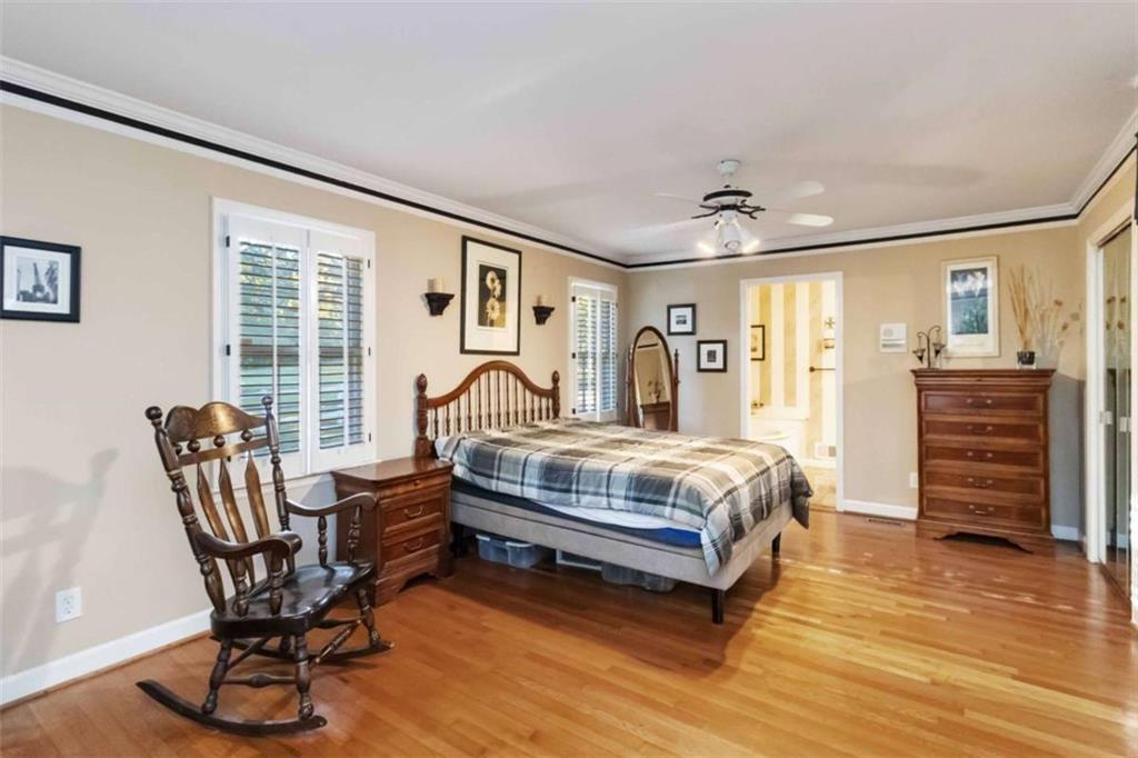 5888 Old Stone Mountain Road Stone Mountain, GA 30087 - Photo 15 of 61 a bedroom with furniture and wooden floor