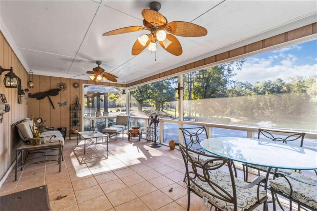 5888 Old Stone Mountain Road Stone Mountain, GA 30087 - Photo 22 of 61 a view of a patio with a table and chairs