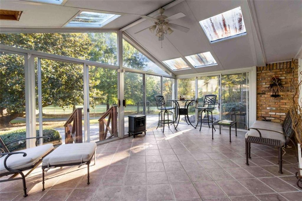 5888 Old Stone Mountain Road Stone Mountain, GA 30087 - Photo 23 of 61 a lobby with furniture and large windows