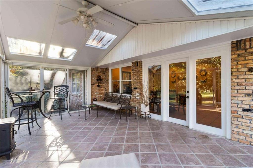 5888 Old Stone Mountain Road Stone Mountain, GA 30087 - Photo 24 of 61 a building outdoor space with patio furniture and potted plants