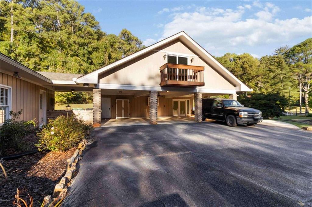 5888 Old Stone Mountain Road Stone Mountain, GA 30087 - Photo 29 of 61 a view of a house with a yard and garage