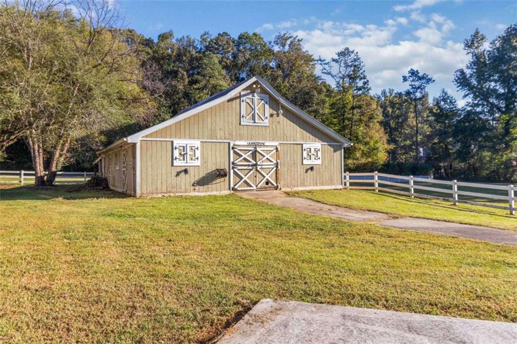 5888 Old Stone Mountain Road Stone Mountain, GA 30087 - Photo 34 of 61 a view of a house with a yard