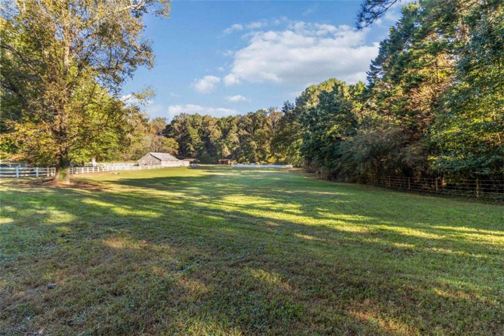 5888 Old Stone Mountain Road Stone Mountain, GA 30087 - Photo 37 of 61 a view of a golf course with a lake
