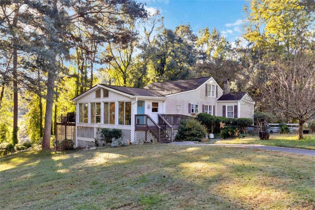 5888 Old Stone Mountain Road Stone Mountain, GA 30087 - Photo 39 of 61 a front view of a house with a yard