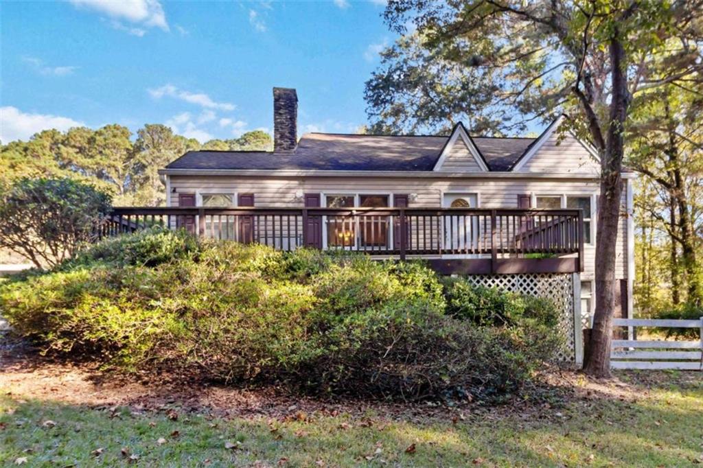 5888 Old Stone Mountain Road Stone Mountain, GA 30087 - Photo 40 of 61 a front view of a house with a yard