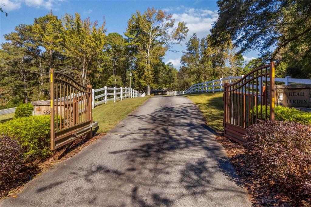 5888 Old Stone Mountain Road Stone Mountain, GA 30087 - Photo 4 of 61 a view of a yard with wooden fence