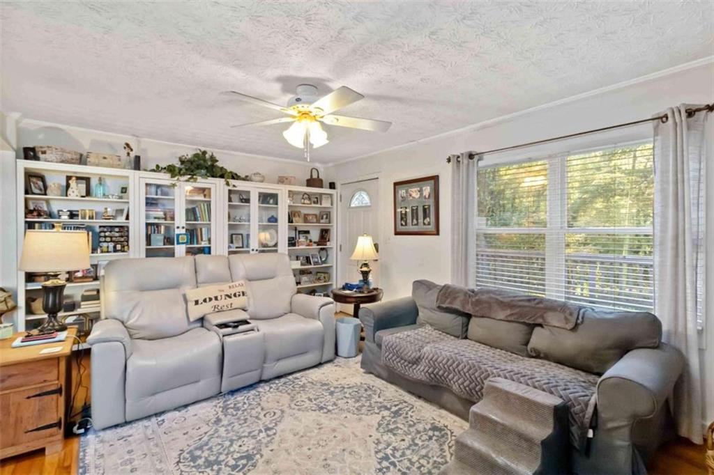 5888 Old Stone Mountain Road Stone Mountain, GA 30087 - Photo 41 of 61 a living room with furniture and a large window