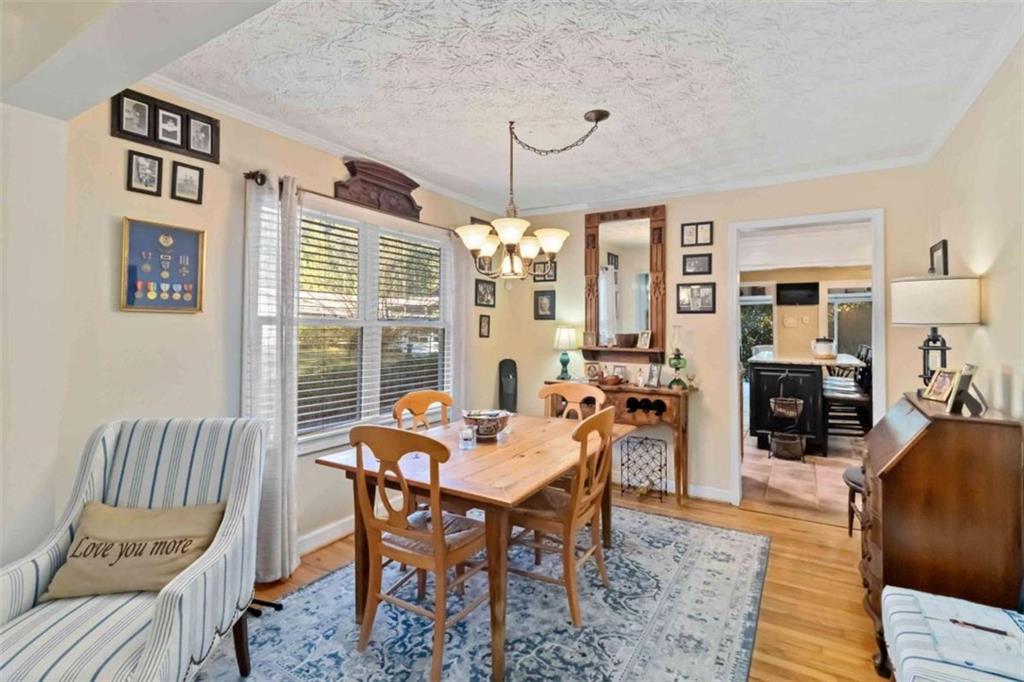 5888 Old Stone Mountain Road Stone Mountain, GA 30087 - Photo 49 of 61 a view of a dining room with furniture window and wooden floor
