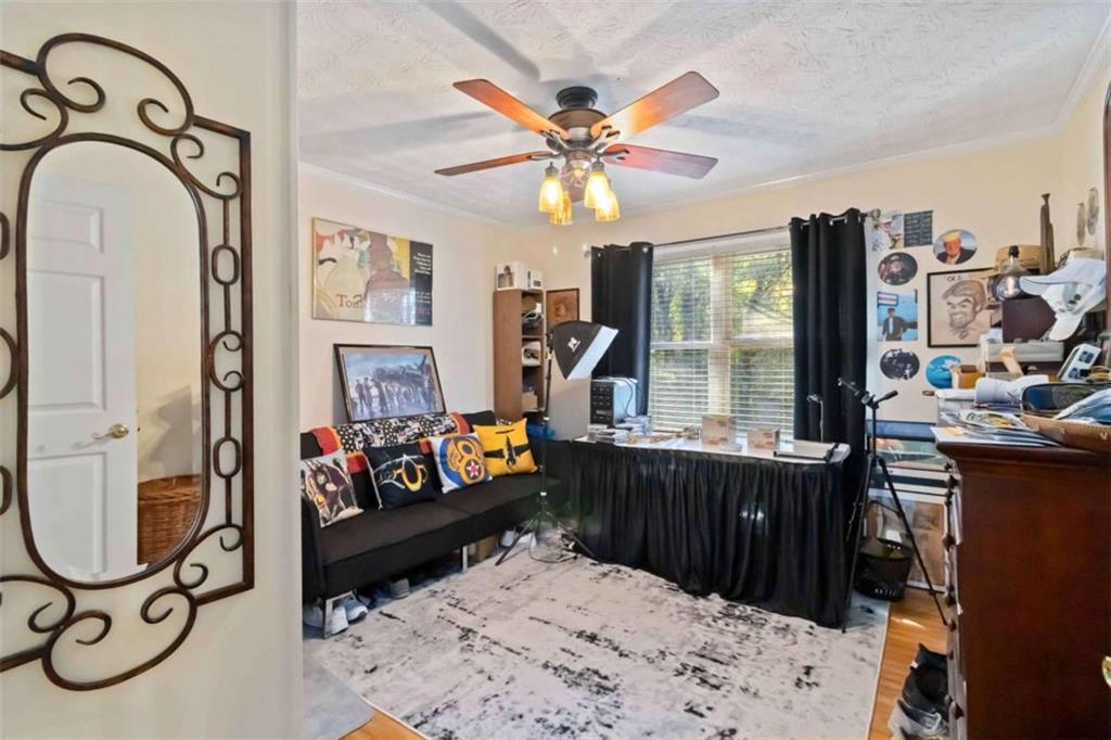 5888 Old Stone Mountain Road Stone Mountain, GA 30087 - Photo 53 of 61 a living room with furniture a window and a chandelier