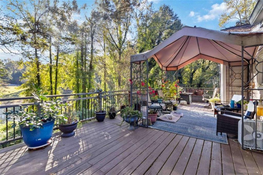 5888 Old Stone Mountain Road Stone Mountain, GA 30087 - Photo 54 of 61 a view of a two chairs and table on the wooden floor