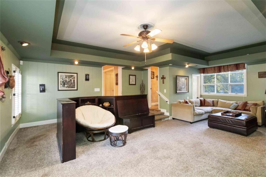 5888 Old Stone Mountain Road Stone Mountain, GA 30087 - Photo 7 of 61 a living room with furniture and a large window