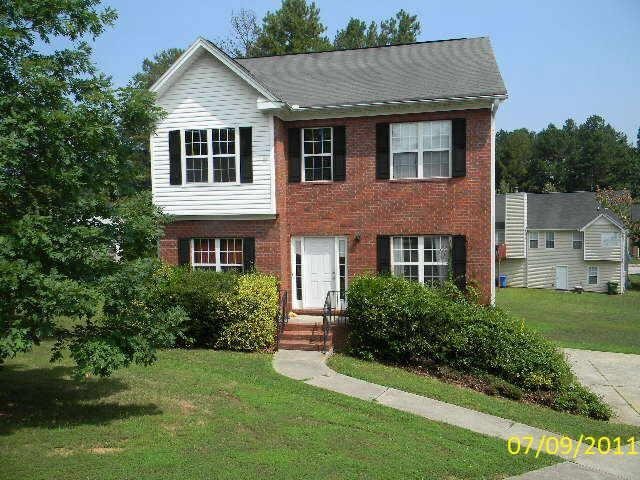 1983 Sand Dollar Court Southwest Atlanta, GA 30331 - Photo 1 of 1 a front view of a house with a yard