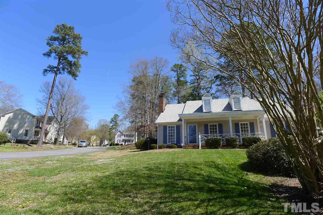 2708 Heathersmith Court Raleigh, NC 27604 - Photo 17 of 25 a front view of a house with a garden and trees