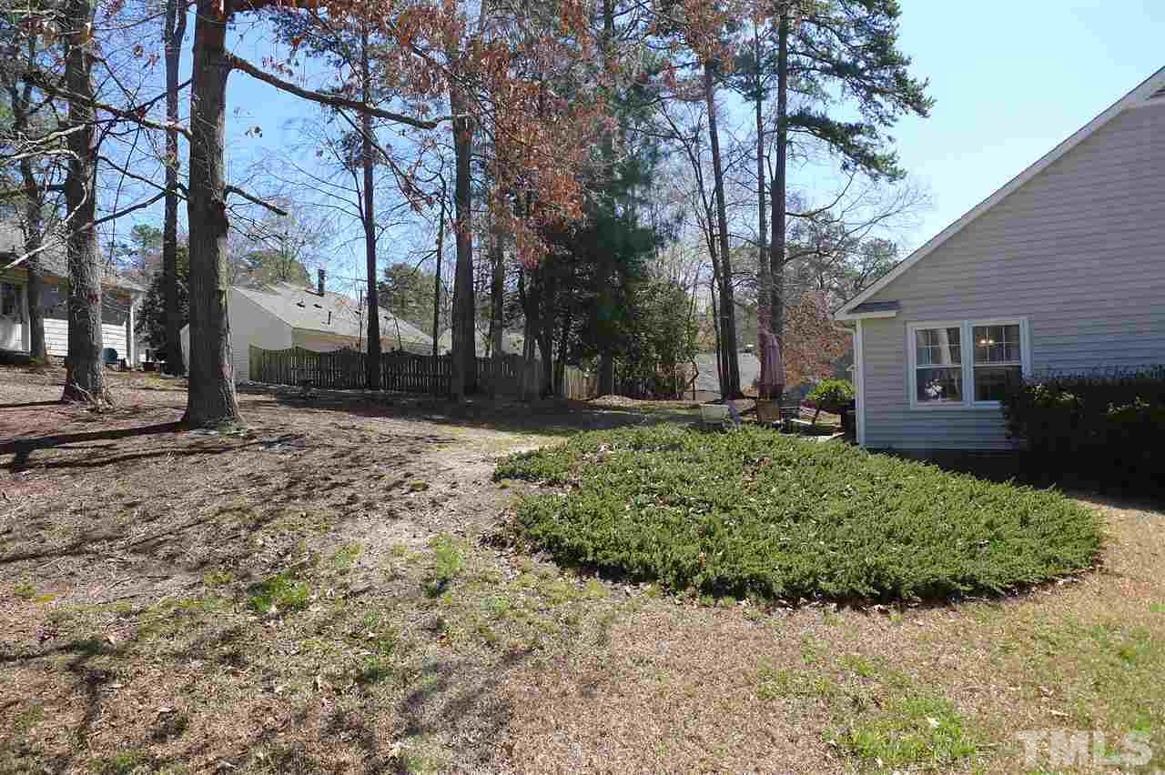 2708 Heathersmith Court Raleigh, NC 27604 - Photo 20 of 25 a backyard of a house with lots of green space