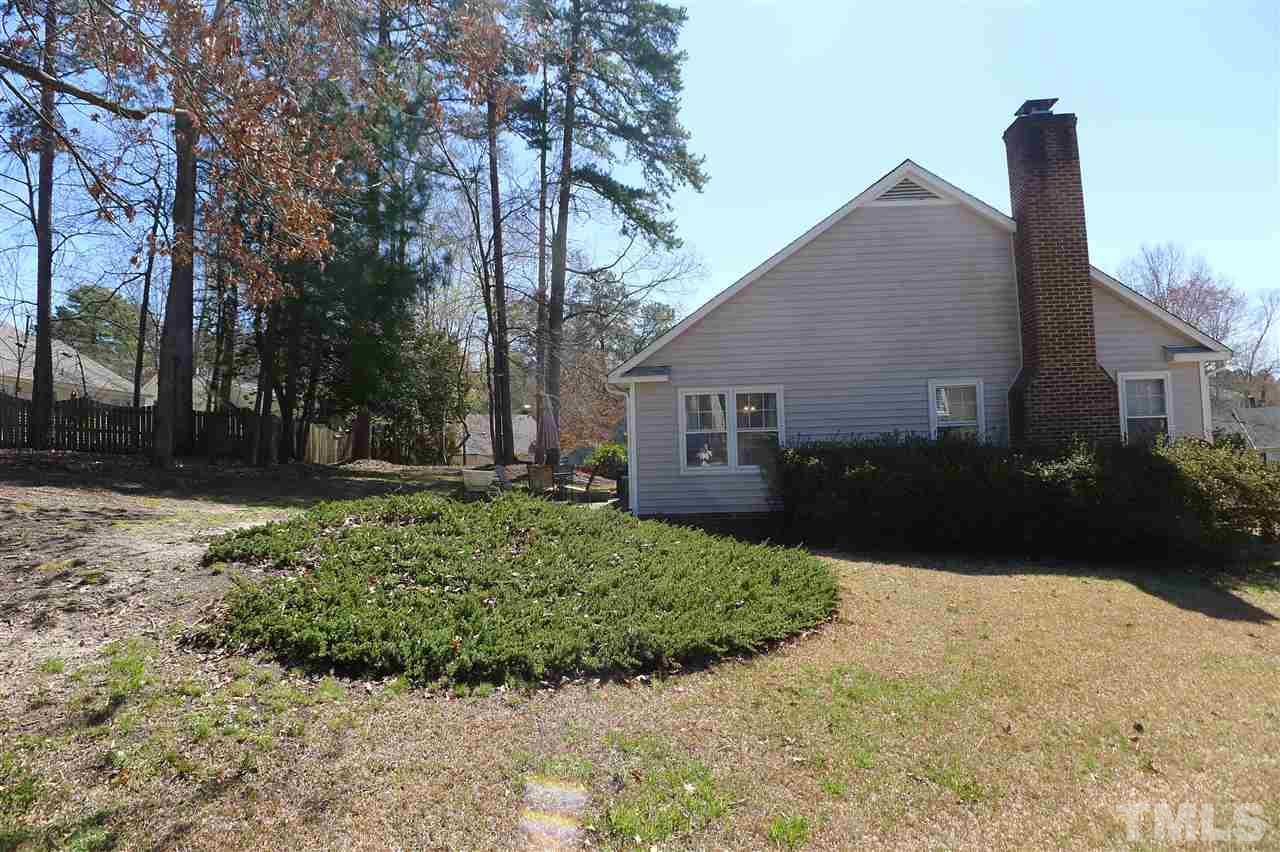 2708 Heathersmith Court Raleigh, NC 27604 - Photo 21 of 25 a view of backyard of house along with trees