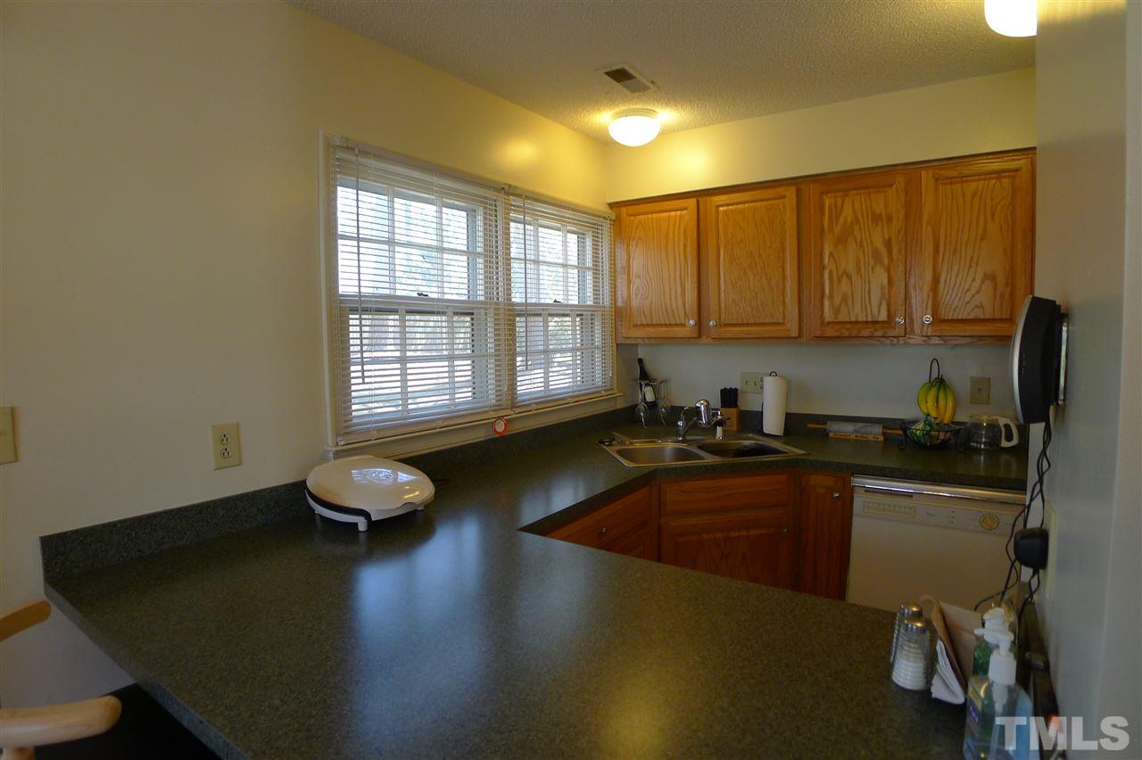 2708 Heathersmith Court Raleigh, NC 27604 - Photo 6 of 25 a kitchen with a sink appliances and cabinets
