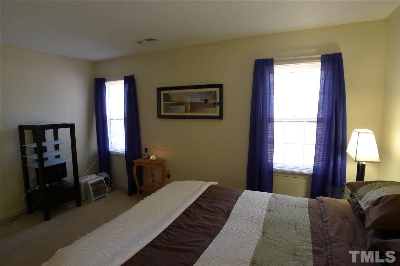 2708 Heathersmith Court Raleigh, NC 27604 - Photo 10 of 25 a bedroom with a bed and a window