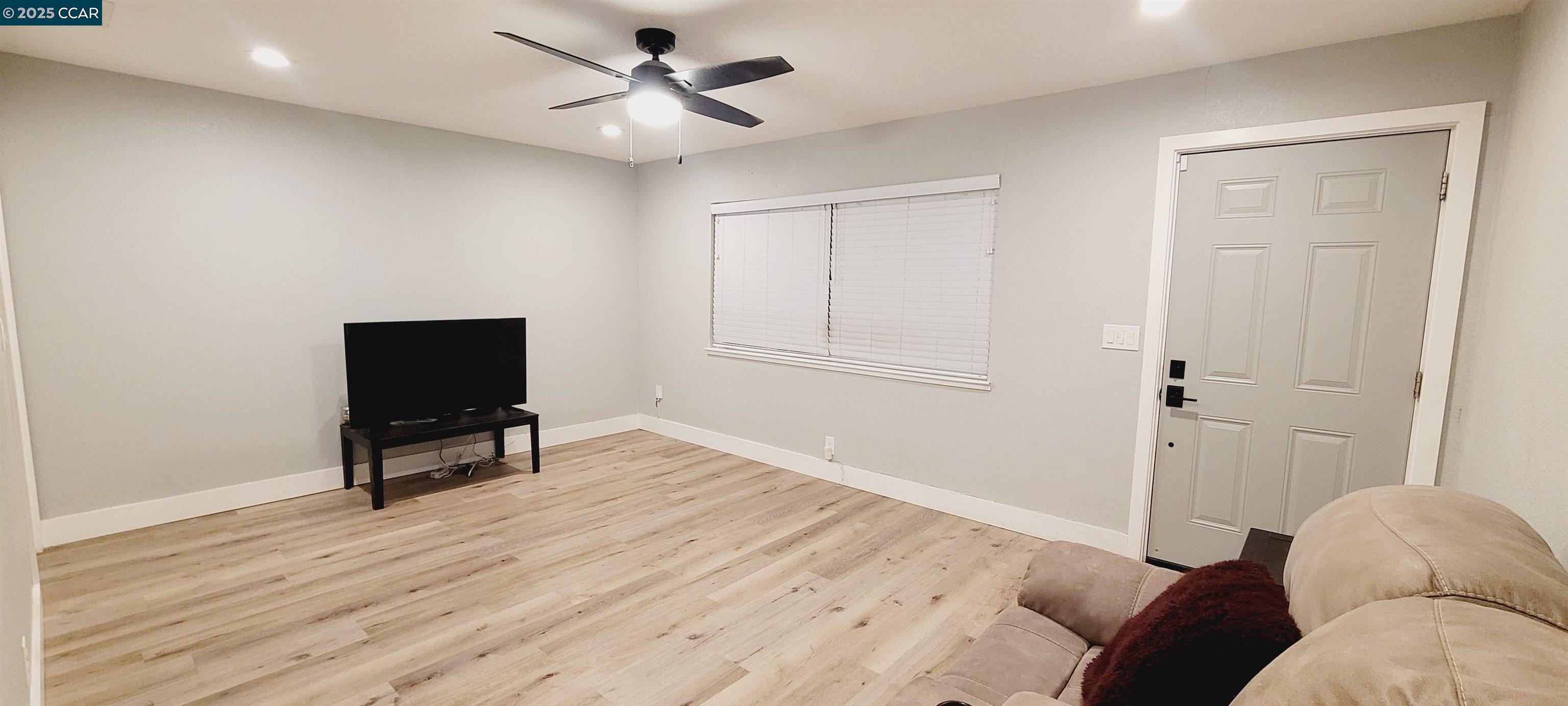 2744 El Rey Street Antioch, CA 94509 - Photo 16 of 23 a living room with furniture and a wooden floor