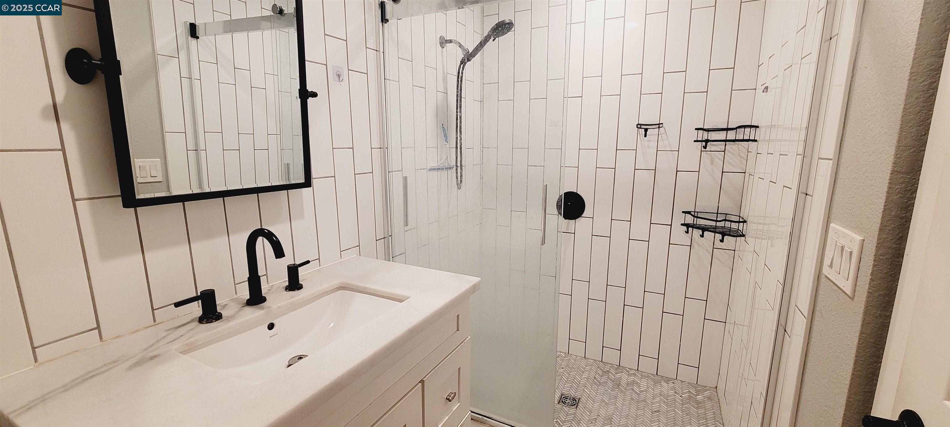 2744 El Rey Street Antioch, CA 94509 - Photo 20 of 23 a bathroom with a sink and mirror