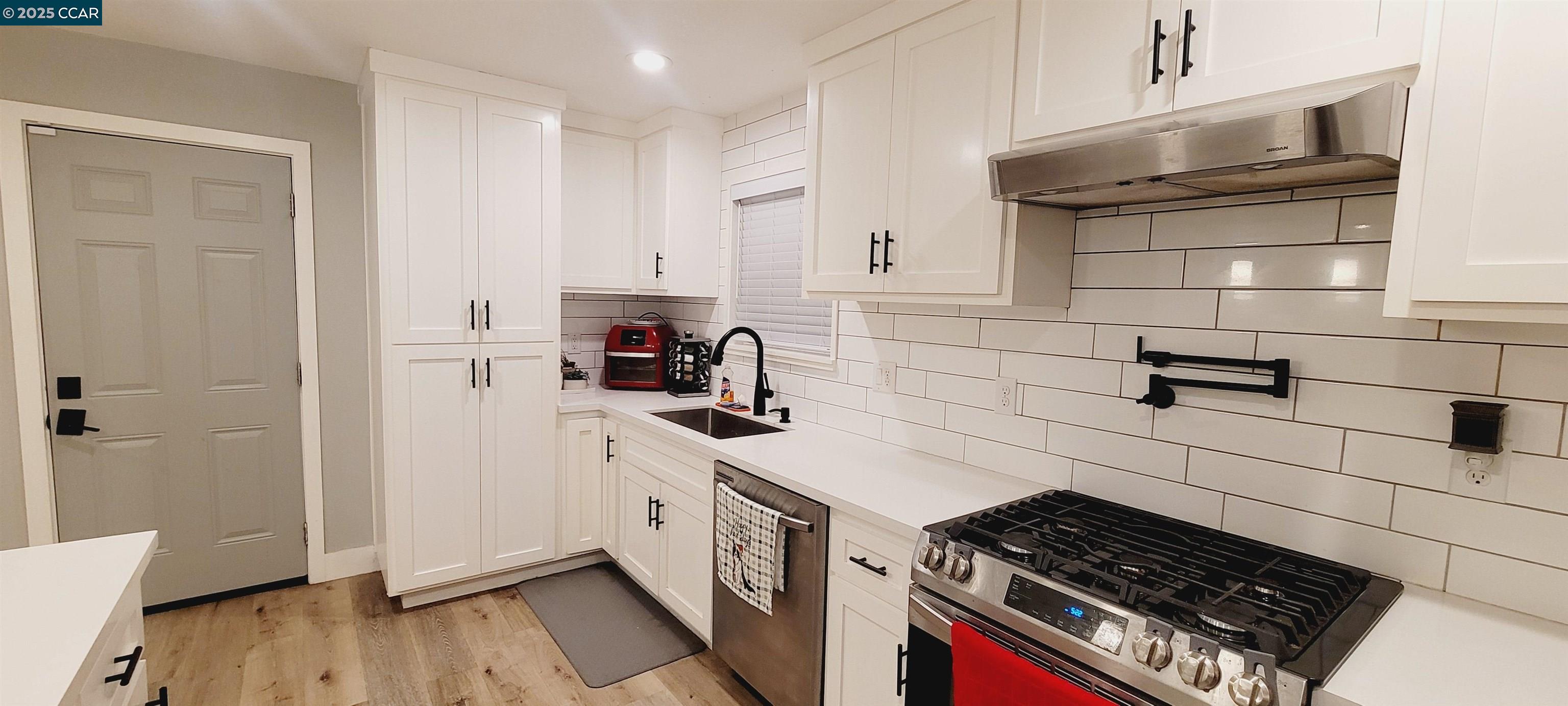 2744 El Rey Street Antioch, CA 94509 - Photo 7 of 23 a kitchen with cabinets and appliances