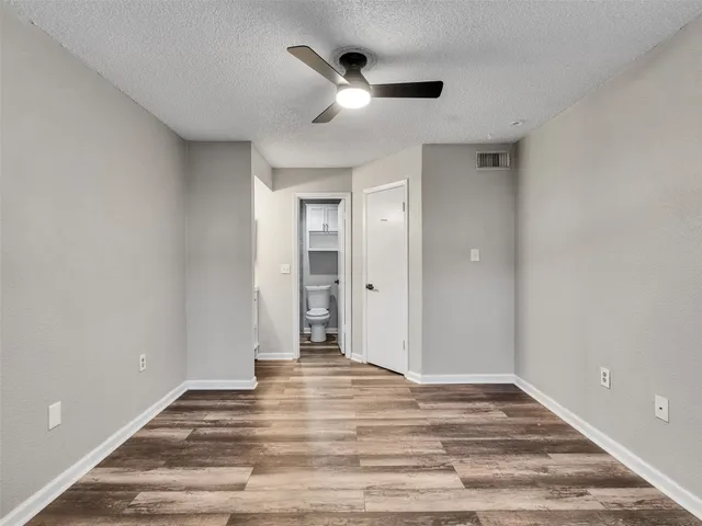 a bathroom with a toilet and a bathtub