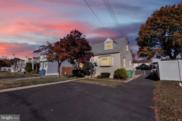 a view of a street with a building in the background
