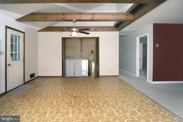 a bathroom with a granite countertop sink a toilet and a shower