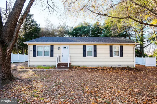 a house with trees in the background