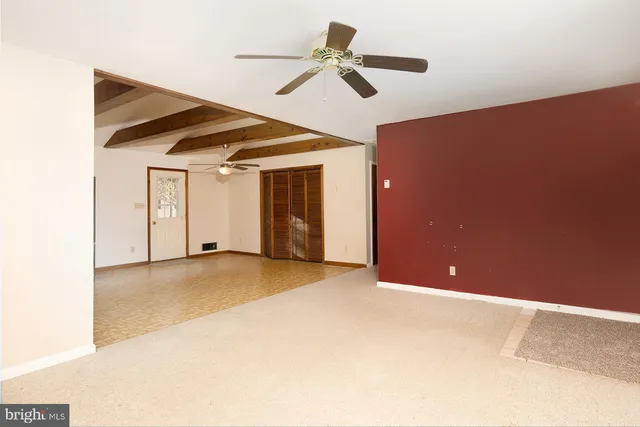 a view of a big room with carpet