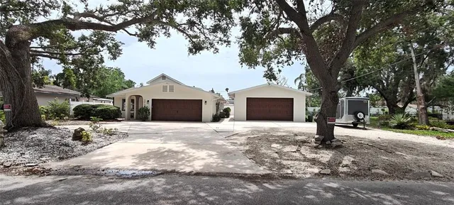 a house with a tree in front of it