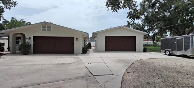 a front view of a house with garage