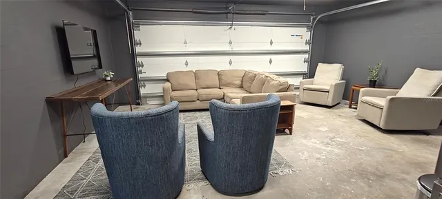 a kitchen with kitchen island granite countertop a refrigerator a stove top oven a sink and dishwasher