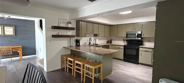 a bedroom with two beds and a bed