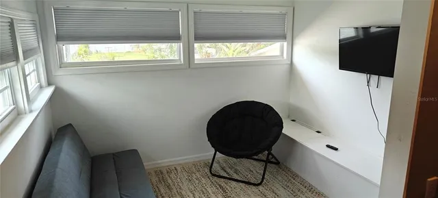 a bedroom with bed and a window