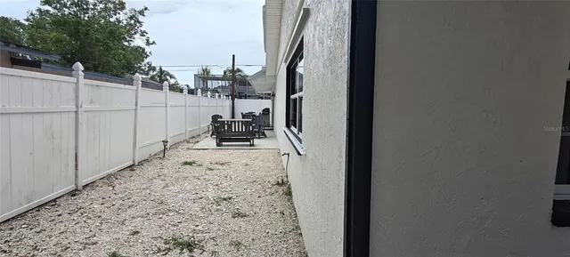 a view of a backyard of the house