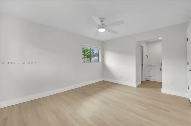 a view of an empty room with a window