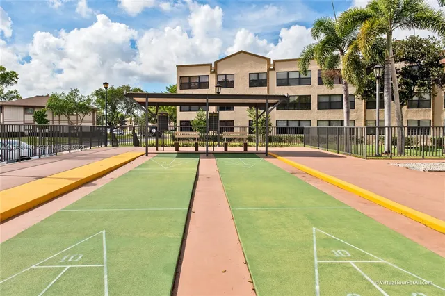 swimming pool with outdoor seating and yard